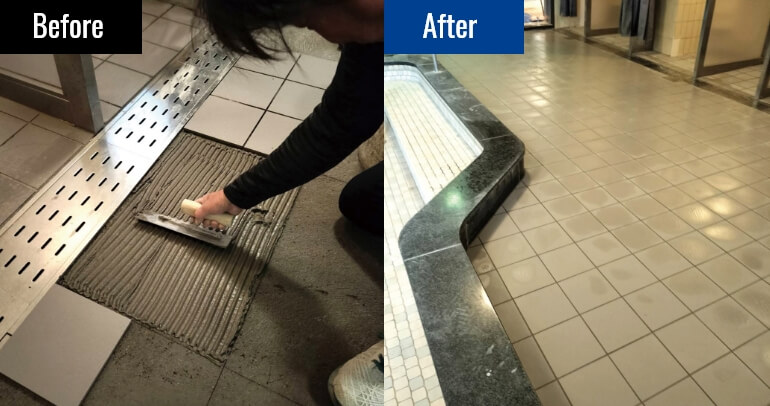 温泉施設の床のタイルの張替えを行うようす